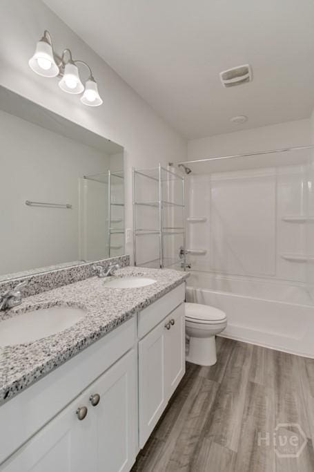 1057 Waybridge Way, Richmond Hill, GA 31324 - bathroom with double vanity, wood finished floors, and bathing tub / shower combination