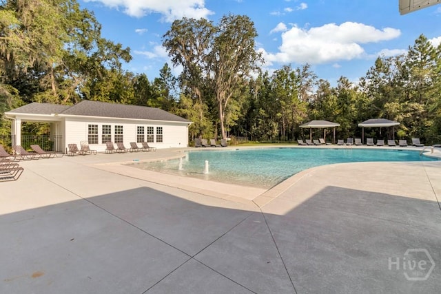 1057 Waybridge Way, Richmond Hill, GA 31324 - community pool with a patio and view of scattered trees