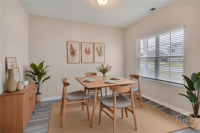 1057 Waybridge Way, Richmond Hill, GA 31324 - dining area featuring light wood finished floors and baseboards