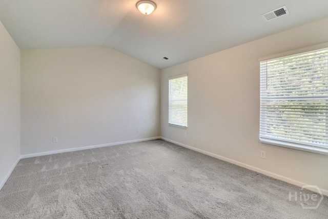 1057 Waybridge Way, Richmond Hill, GA 31324 - spare room featuring healthy amount of natural light, lofted ceiling, and carpet flooring