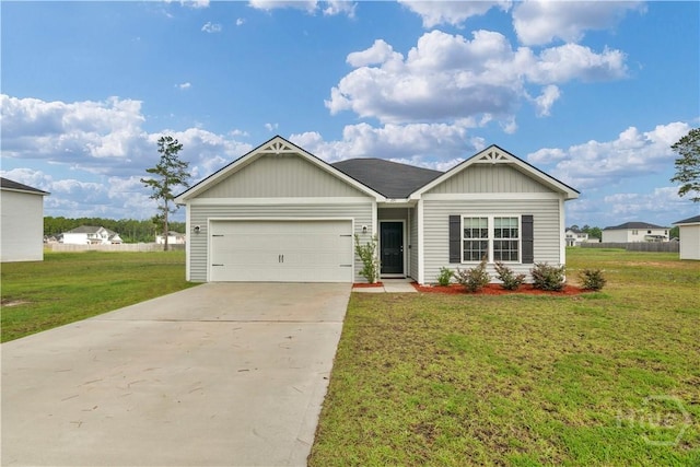 291 Morgan Field Blvd NE, Ludowici, GA 31316 - single story home with a garage, concrete driveway, a front lawn, and board and batten siding