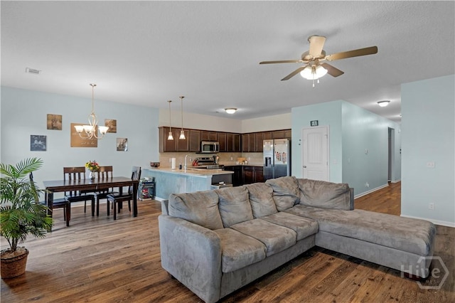 291 Morgan Field Blvd NE, Ludowici, GA 31316 - living room featuring a chandelier, a ceiling fan, and wood finished floors