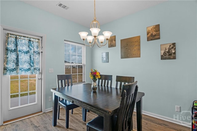 291 Morgan Field Blvd NE, Ludowici, GA 31316 - dining space featuring a chandelier, healthy amount of natural light, and wood finished floors
