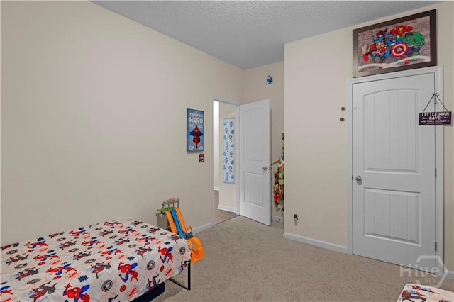 291 Morgan Field Blvd NE, Ludowici, GA 31316 - carpeted bedroom featuring baseboards and a textured ceiling