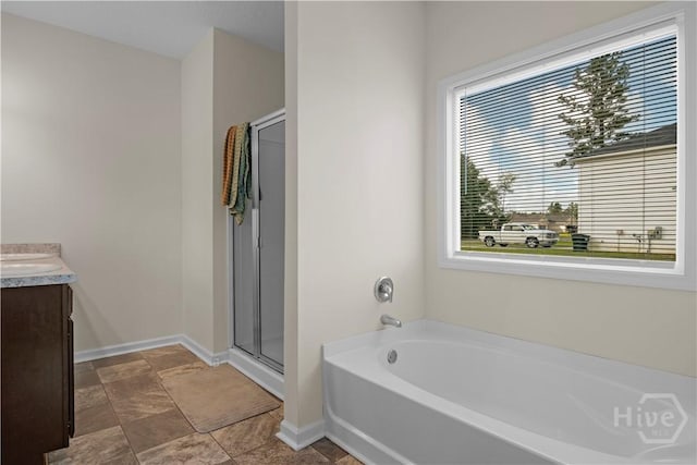 291 Morgan Field Blvd NE, Ludowici, GA 31316 - bathroom featuring a bath, vanity, and a stall shower