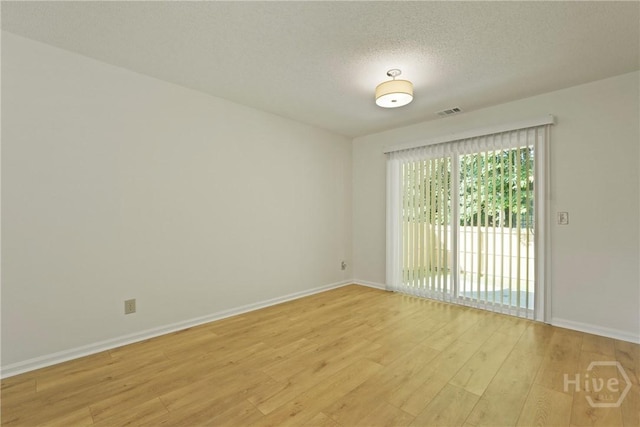 127 Laurel Green Ct, Savannah, GA 31419 - unfurnished room with light wood finished floors and a textured ceiling