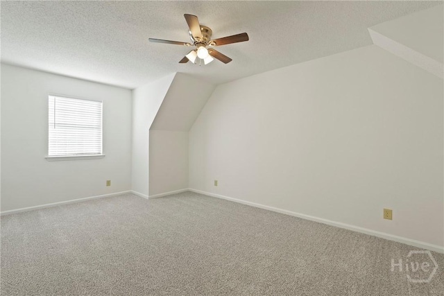 127 Laurel Green Ct, Savannah, GA 31419 - additional living space featuring carpet floors, a ceiling fan, a textured ceiling, and lofted ceiling
