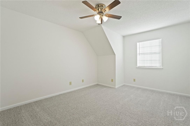 127 Laurel Green Ct, Savannah, GA 31419 - additional living space featuring light carpet, a ceiling fan, vaulted ceiling, and a textured ceiling