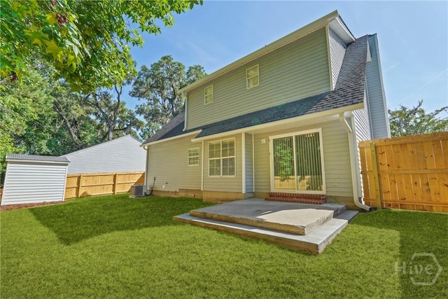 127 Laurel Green Ct, Savannah, GA 31419 - back of property featuring roof with shingles, a fenced backyard, a patio, and an outbuilding