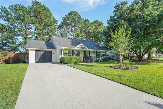 217 Bailee Ave, Rincon, GA 31326 - ranch-style house featuring an attached garage, concrete driveway, and covered porch