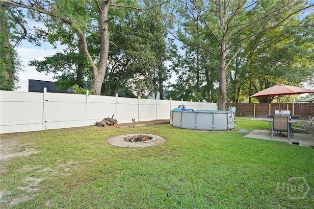 217 Bailee Ave, Rincon, GA 31326 - fenced backyard with a patio area