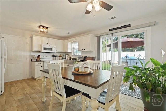 217 Bailee Ave, Rincon, GA 31326 - dining room featuring light wood finished floors and a ceiling fan