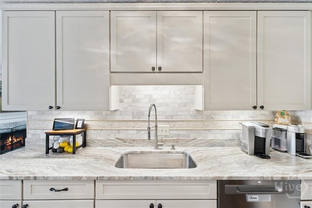 3 Watford Rd, Savannah, GA 31419 - kitchen with dishwasher, backsplash, light stone counters, and white cabinets