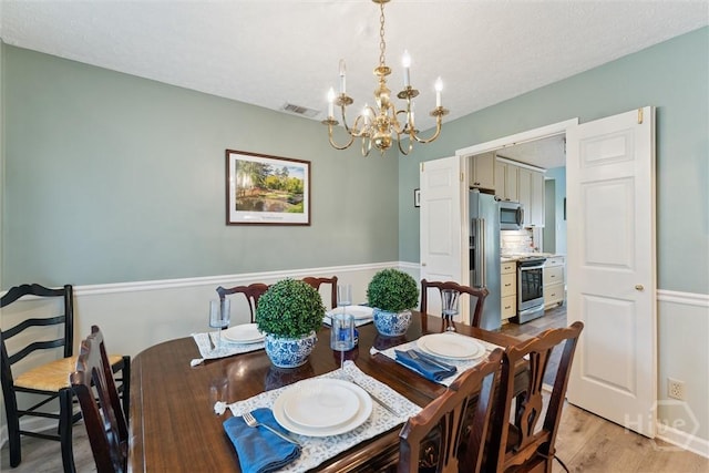 3 Watford Rd, Savannah, GA 31419 - dining area with a chandelier and light wood-style flooring