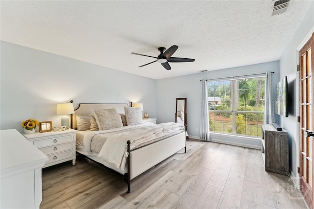 3 Watford Rd, Savannah, GA 31419 - bedroom featuring light wood finished floors, ceiling fan, and a textured ceiling