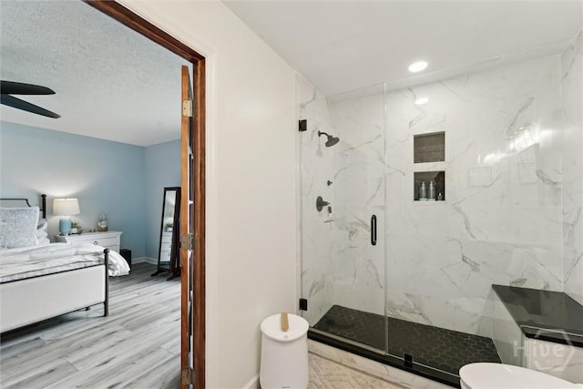 3 Watford Rd, Savannah, GA 31419 - ensuite bathroom featuring a marble finish shower, ceiling fan, recessed lighting, and wood finished floors