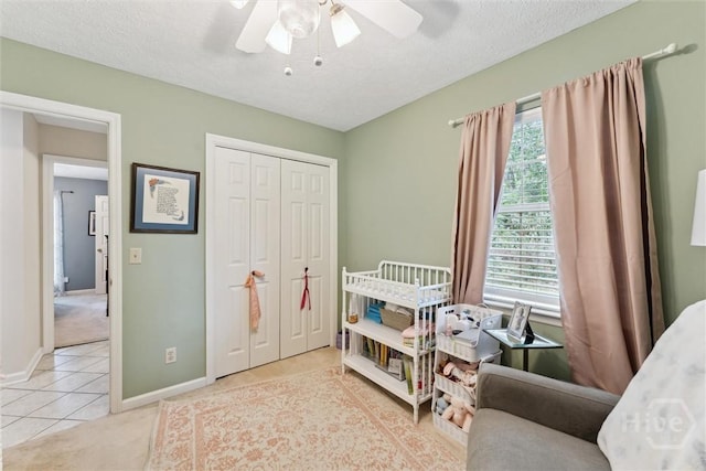 3 Watford Rd, Savannah, GA 31419 - tiled bedroom featuring a closet, ceiling fan, and a textured ceiling