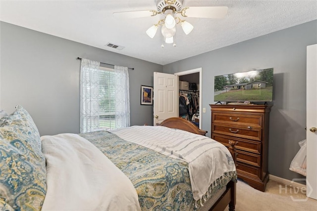 3 Watford Rd, Savannah, GA 31419 - bedroom with light carpet, a spacious closet, a ceiling fan, and a closet