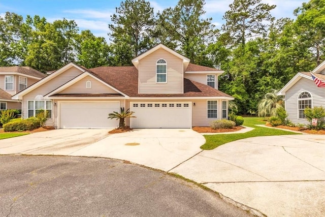 24 Marsh Hen Ct, Richmond Hill, GA 31324 - traditional-style home with concrete driveway, an attached garage, a front lawn, and roof with shingles