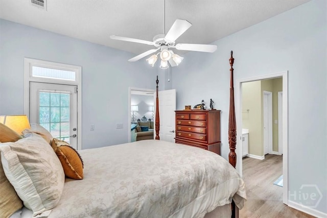 24 Marsh Hen Ct, Richmond Hill, GA 31324 - bedroom featuring light wood-style flooring, a ceiling fan, and ensuite bathroom