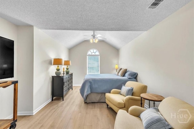 24 Marsh Hen Ct, Richmond Hill, GA 31324 - bedroom with light wood-type flooring, a textured ceiling, a ceiling fan, and lofted ceiling