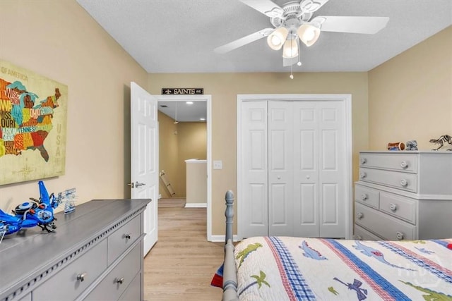 24 Marsh Hen Ct, Richmond Hill, GA 31324 - bedroom featuring light wood-style flooring, a closet, and ceiling fan