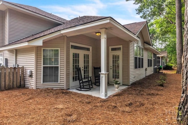 24 Marsh Hen Ct, Richmond Hill, GA 31324 - back of house featuring french doors, a shingled roof, and a patio