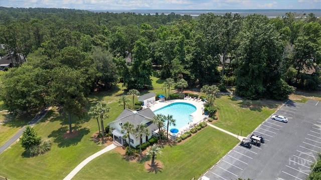 24 Marsh Hen Ct, Richmond Hill, GA 31324 - aerial view of a pool area and a heavily wooded area