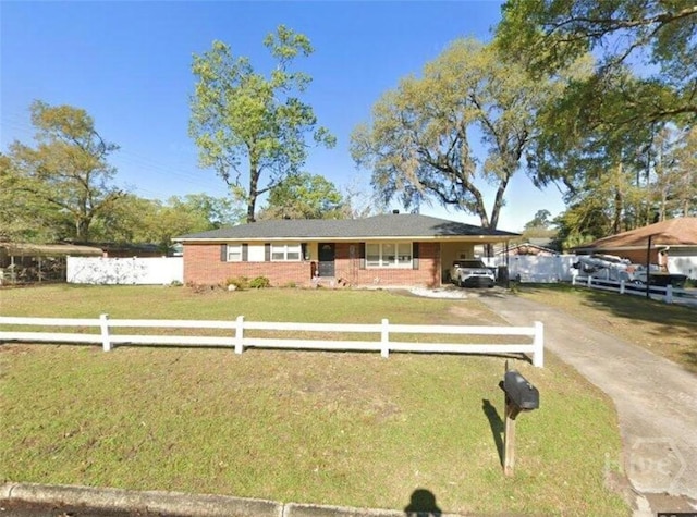 11 La Brea Blvd, Savannah, GA 31419 - ranch-style house featuring driveway, a carport, and brick siding