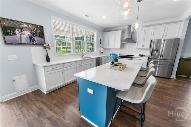 176 Trail Creek Ln, Savannah, GA 31405 - kitchen with appliances with stainless steel finishes, wall chimney exhaust hood, crown molding, a center island, and backsplash