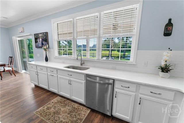 176 Trail Creek Ln, Savannah, GA 31405 - kitchen with stainless steel dishwasher, white cabinetry, dark wood-style flooring, light countertops, and decorative backsplash
