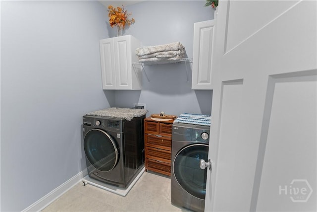 176 Trail Creek Ln, Savannah, GA 31405 - laundry room with cabinet space, washer and dryer, and light tile patterned floors