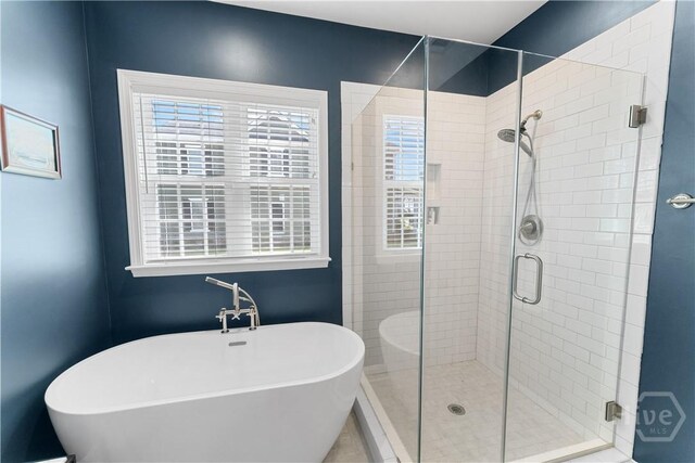 176 Trail Creek Ln, Savannah, GA 31405 - bathroom featuring a freestanding tub, a stall shower, and healthy amount of natural light