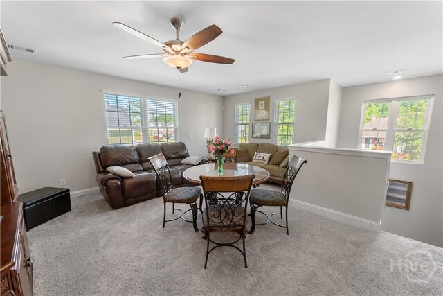 176 Trail Creek Ln, Savannah, GA 31405 - carpeted dining area with plenty of natural light and ceiling fan