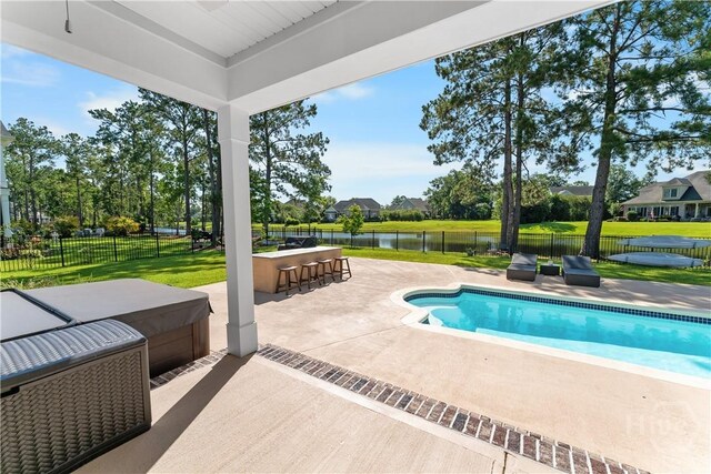 176 Trail Creek Ln, Savannah, GA 31405 - view of swimming pool with a water view, a patio area, and a fenced backyard