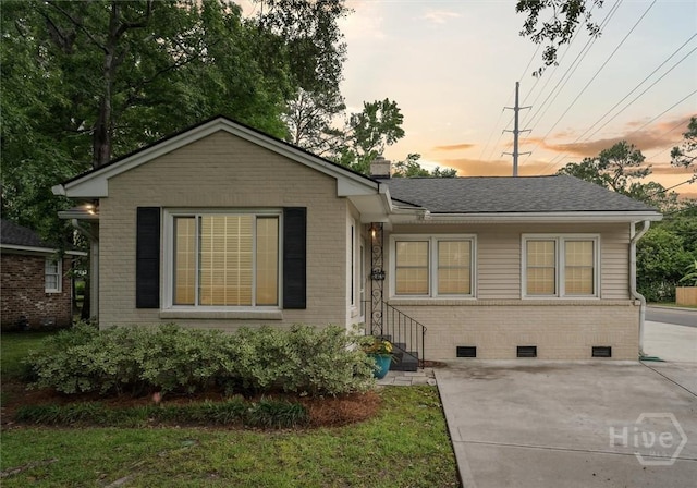 330 E 64th St, Savannah, GA 31405 - view of front of house featuring brick siding, crawl space, a chimney, and roof with shingles