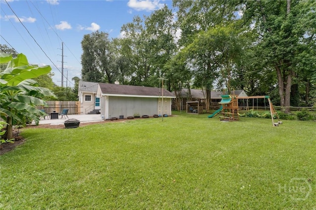 330 E 64th St, Savannah, GA 31405 - fenced backyard with a playground, a patio, and an outdoor structure