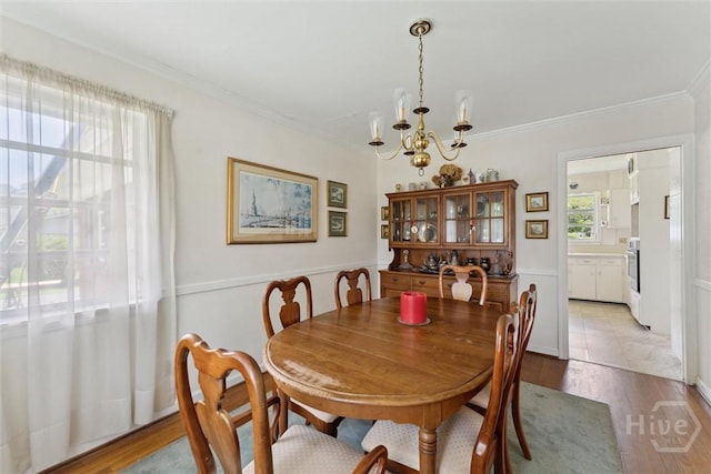 130 Hopecrest Ave, Savannah, GA 31406 - dining room featuring a chandelier, light wood-style flooring, and ornamental molding