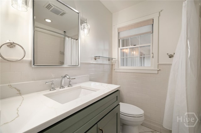 103 Kentshire Ct, Savannah, GA 31410 - full bathroom featuring tile walls, vanity, and a wainscoted wall