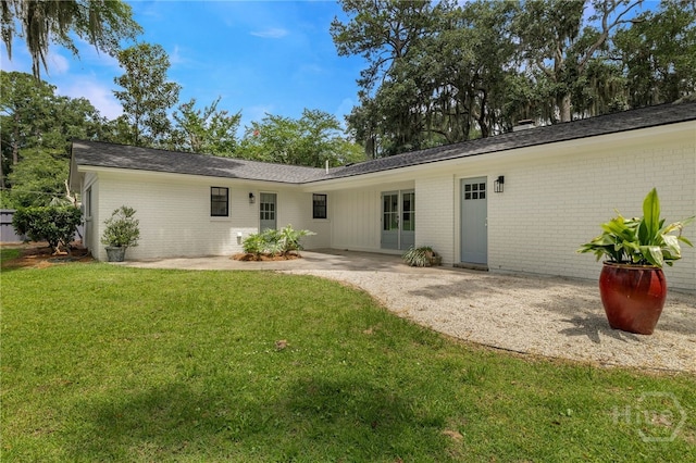 103 Kentshire Ct, Savannah, GA 31410 - rear view of property featuring brick siding, a lawn, a patio, and french doors