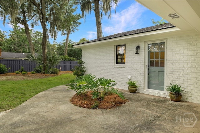 103 Kentshire Ct, Savannah, GA 31410 - view of property exterior with brick siding and a patio