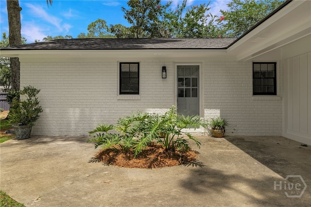 103 Kentshire Ct, Savannah, GA 31410 - entrance to property with brick siding, a patio area, and a shingled roof