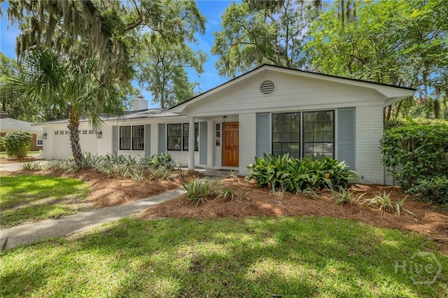 103 Kentshire Ct, Savannah, GA 31410 - ranch-style house with brick siding, a garage, a chimney, and a front yard