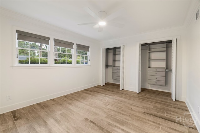 103 Kentshire Ct, Savannah, GA 31410 - unfurnished bedroom with ornamental molding, two closets, light wood finished floors, and a ceiling fan