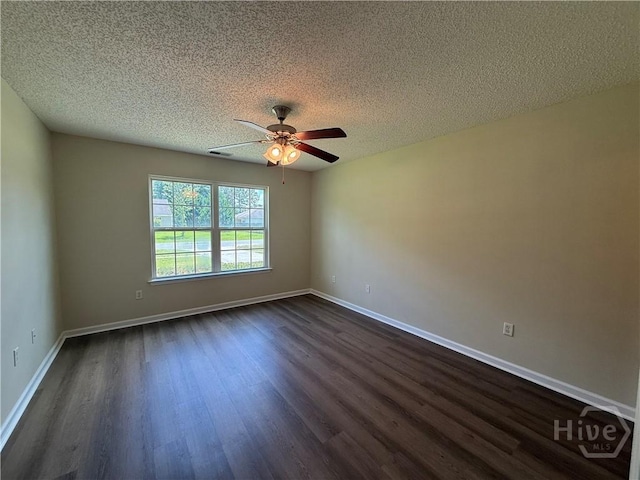 150 Knotty Pine Cir, Springfield, GA 31329 - empty room featuring dark wood-style flooring, a ceiling fan, and a textured ceiling