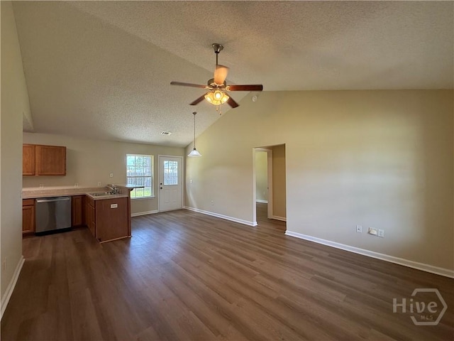 150 Knotty Pine Cir, Springfield, GA 31329 - unfurnished living room with a textured ceiling, dark wood-type flooring, a ceiling fan, and lofted ceiling