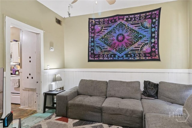 545 E Macon St, Savannah, GA 31401 - living room with wainscoting and ceiling fan