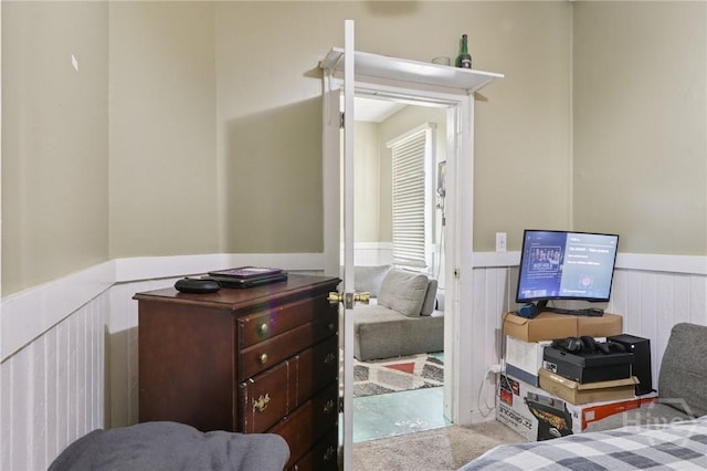 545 E Macon St, Savannah, GA 31401 - bedroom with a wainscoted wall and carpet