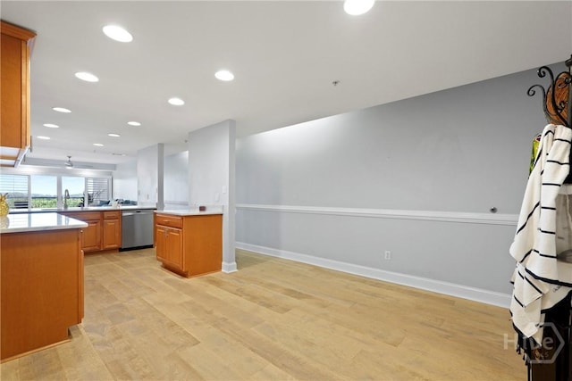 3113 River Dr Unit 10, Savannah, GA 31404 - kitchen with stainless steel dishwasher, light wood finished floors, light countertops, recessed lighting, and open floor plan