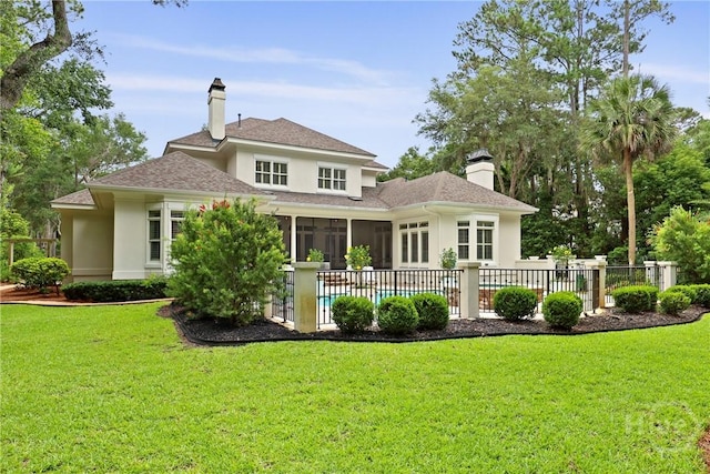 26 Little Comfort Rd, Savannah, GA 31411 - rear view of property with stucco siding, a sunroom, a chimney, and a shingled roof